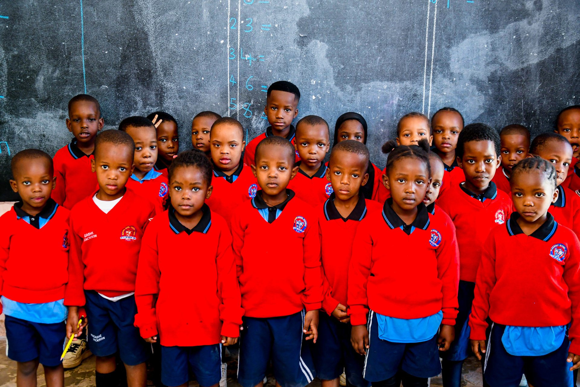 Group trip participants with local children